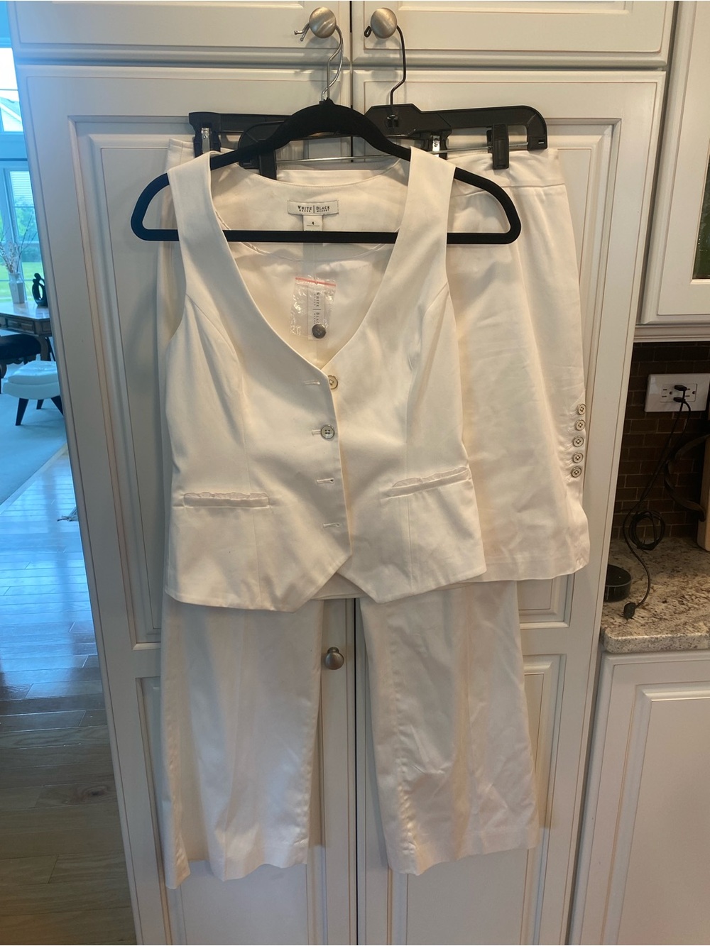 White House Black Market: White Three Piece - pants; skirt and vest.